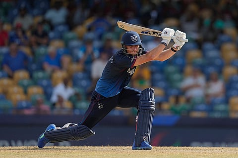 Gerhard Erasmus plays a shot against Scotland